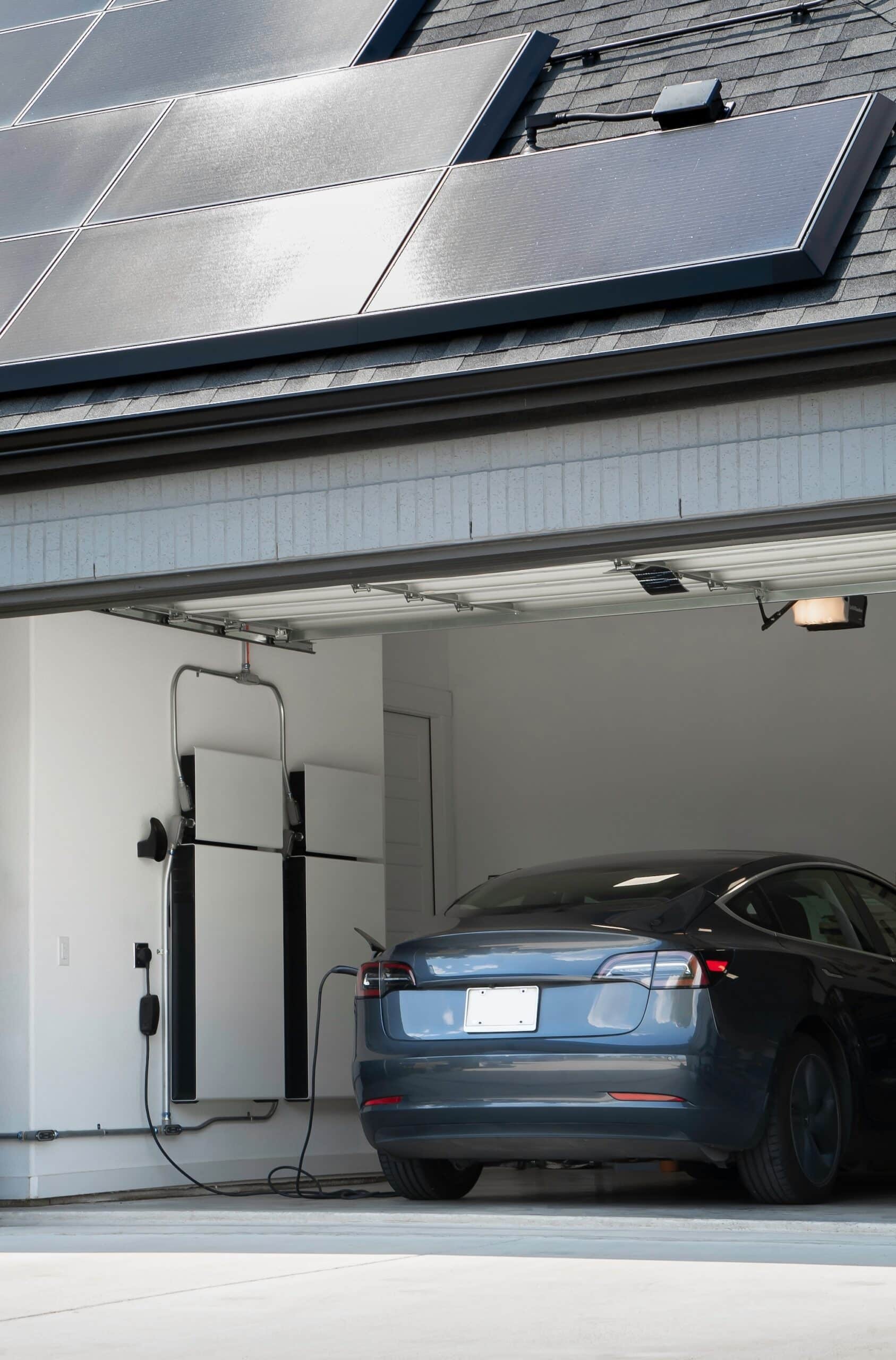 Car in stunning modern garage with a Solar Battery and Solar Panels On The Roof